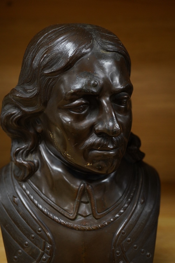 Two bronze busts of Oliver Cromwell, indistinctly signed and Thomas Carlyle, largest 26cm high